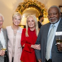 A group of people stand together